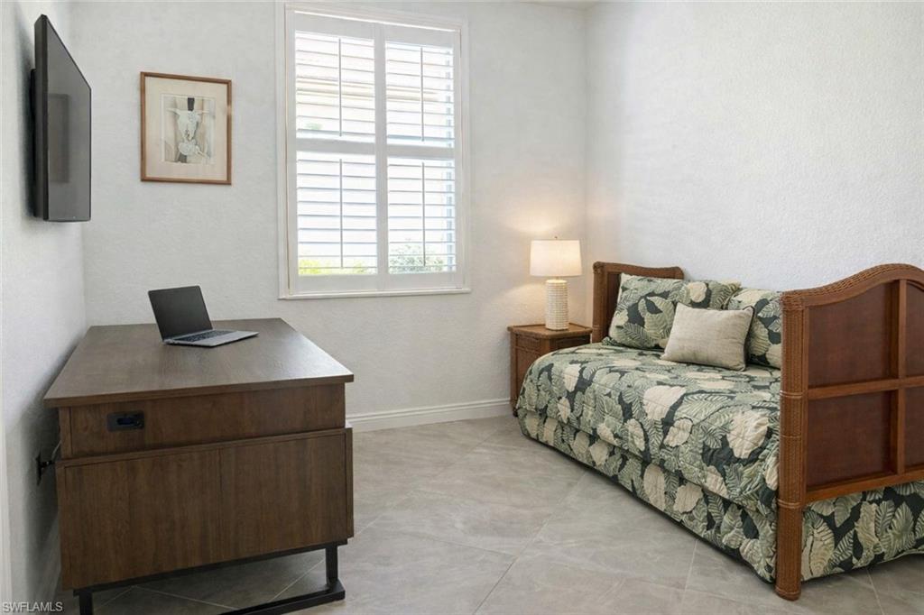 17609 Ashcomb Way Estero, FL 33928 - Photo 12 of 40 Bedroom featuring an office area and a textured wall