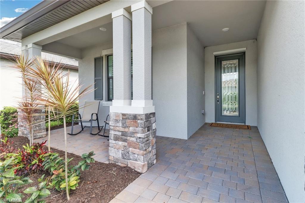 17609 Ashcomb Way Estero, FL 33928 - Photo 19 of 40 Entrance to property with covered porch and stucco siding