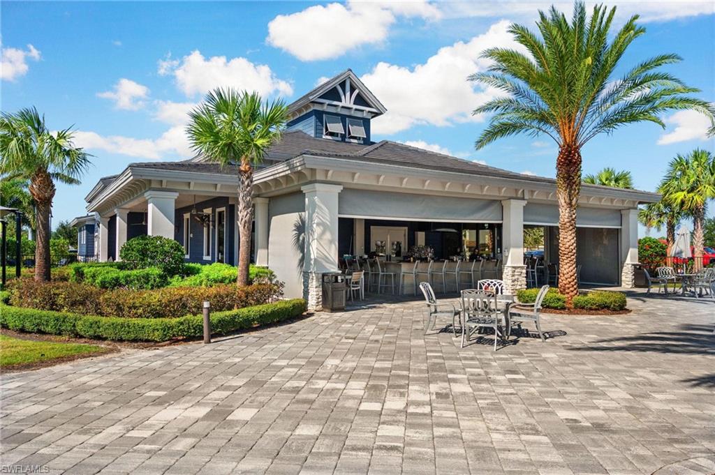 17609 Ashcomb Way Estero, FL 33928 - Photo 28 of 40 View of building exterior featuring driveway