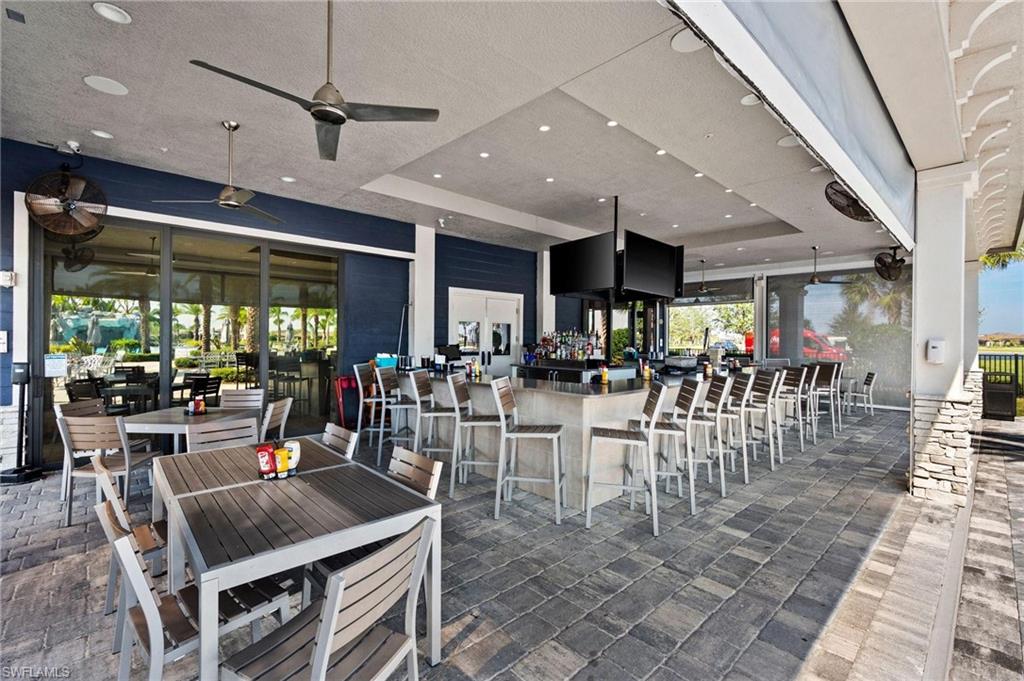 17609 Ashcomb Way Estero, FL 33928 - Photo 31 of 40 View of patio / terrace with a ceiling fan and an outdoor bar and dining area