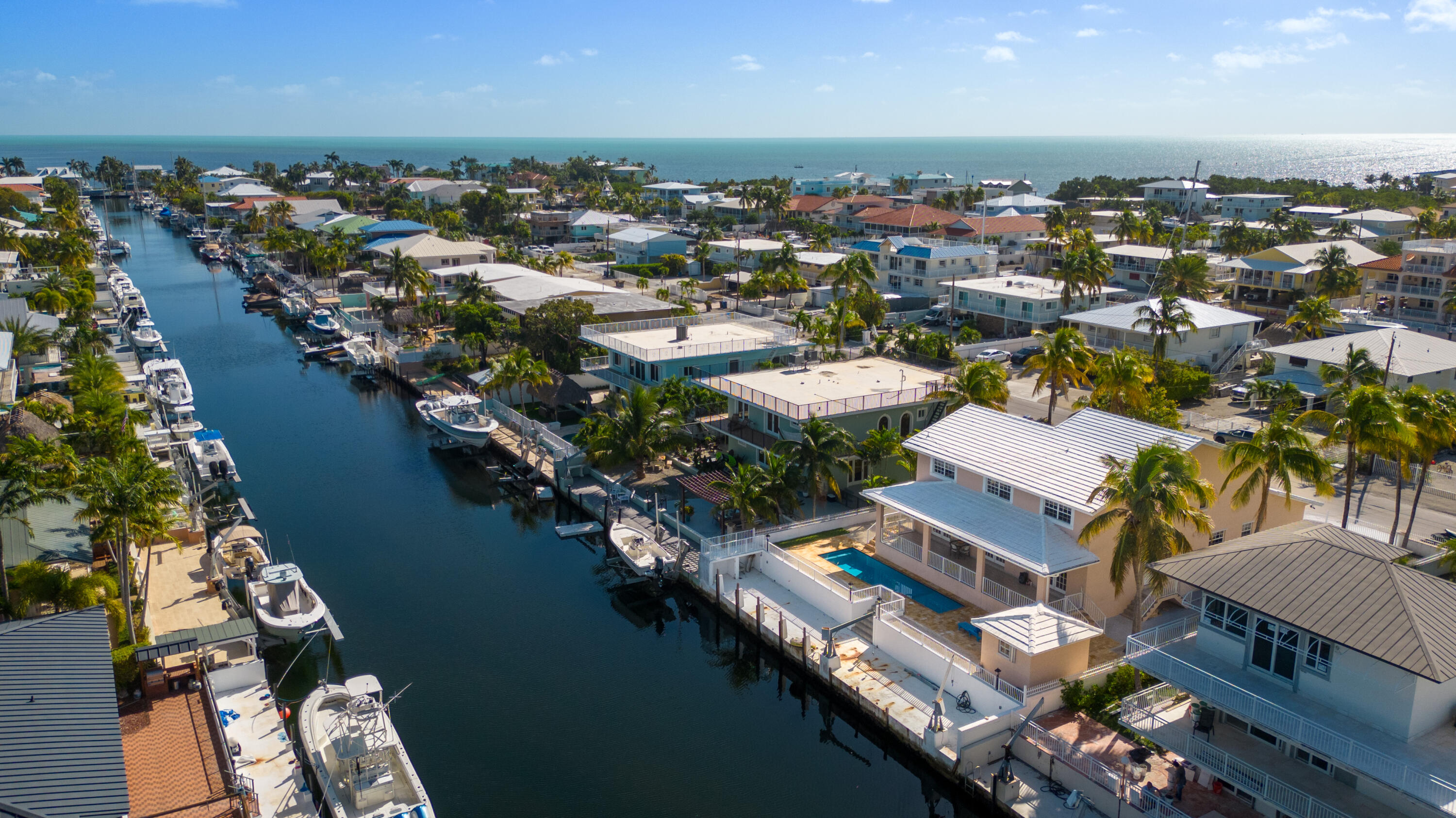 239 Atlantic Boulevard Key Largo, FL 33037 - Photo 2 of 50 an aerial view of residential houses with outdoor space