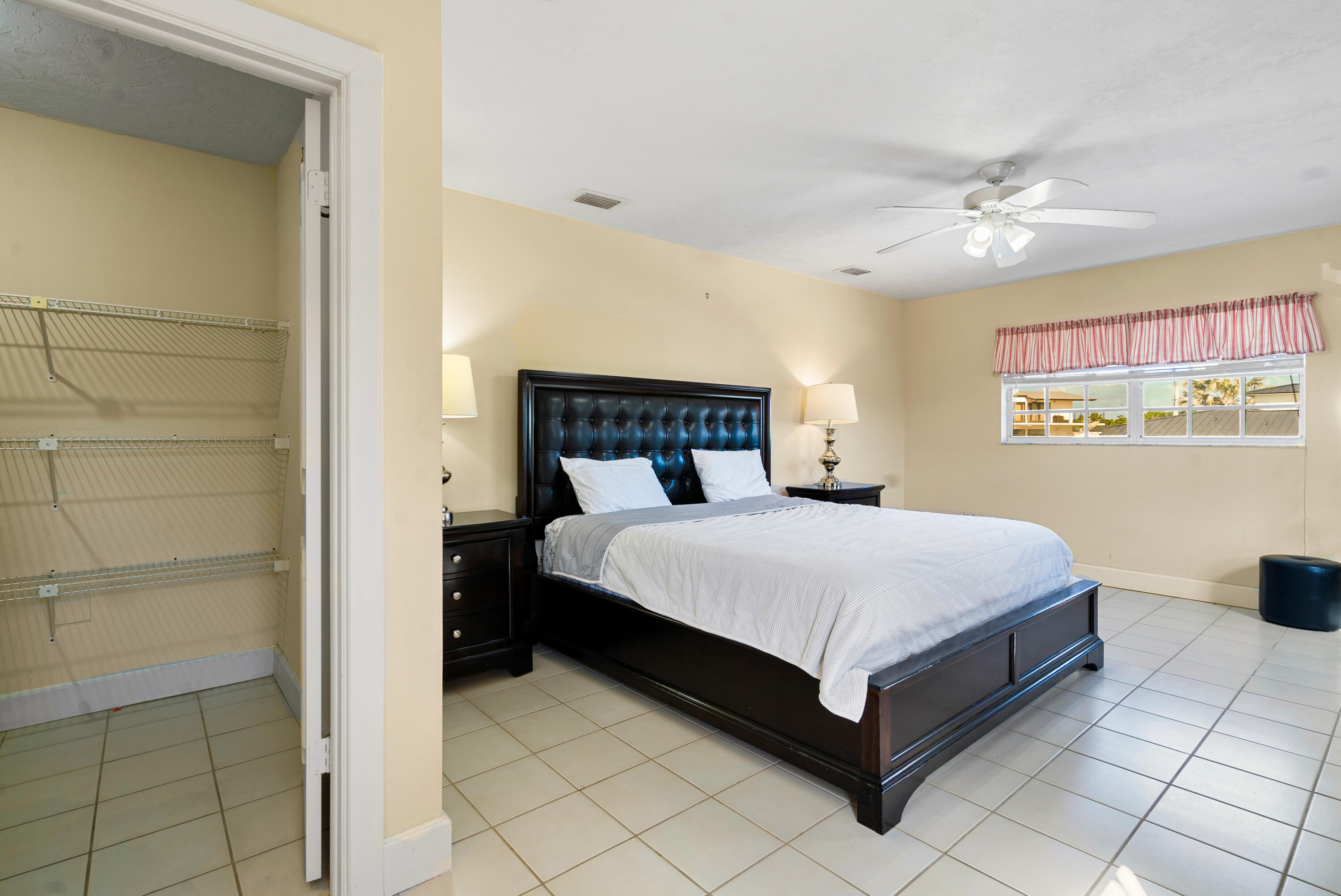 239 Atlantic Boulevard Key Largo, FL 33037 - Photo 25 of 50 a bedroom with a bed and a table