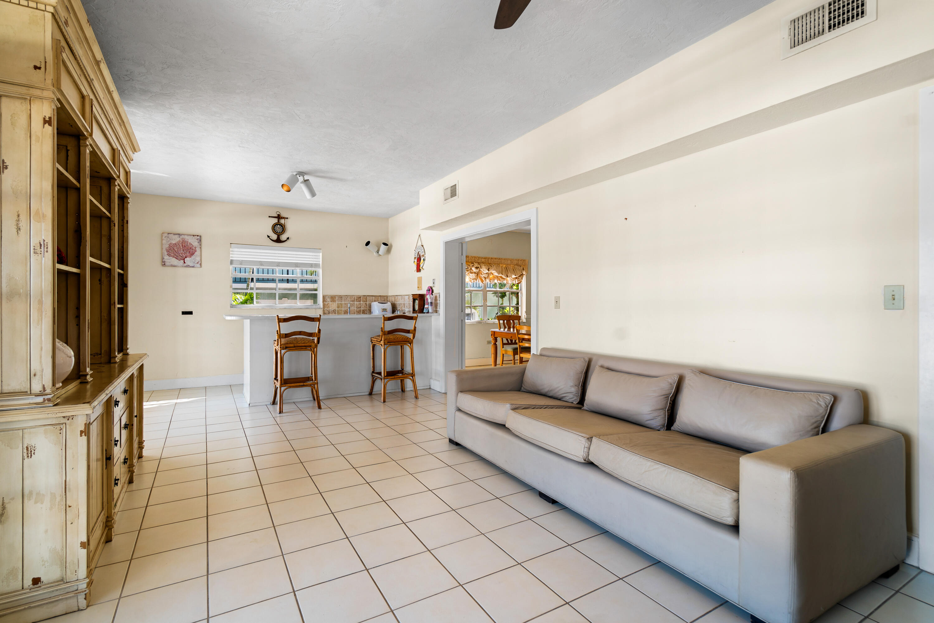 239 Atlantic Boulevard Key Largo, FL 33037 - Photo 10 of 50 a living room with furniture and a flat screen tv