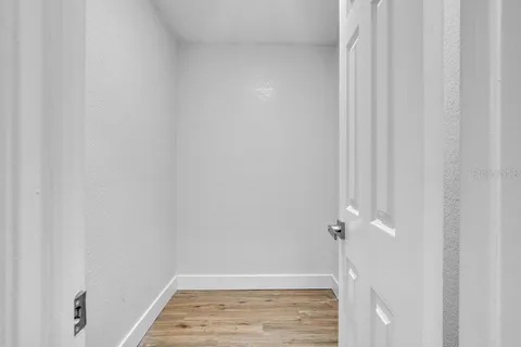 a bathroom with a granite countertop sink a toilet a mirror and shower