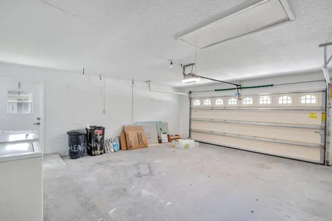 a view of a backyard with a garden and entertaining space