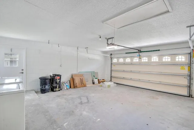 a view of a backyard with a garden and entertaining space