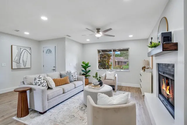 a living room with furniture and a fireplace