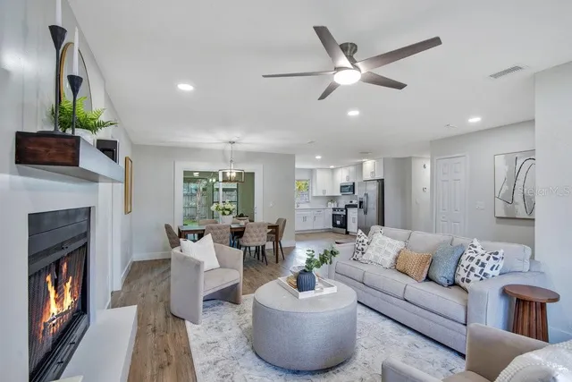 a living room with furniture and a fireplace