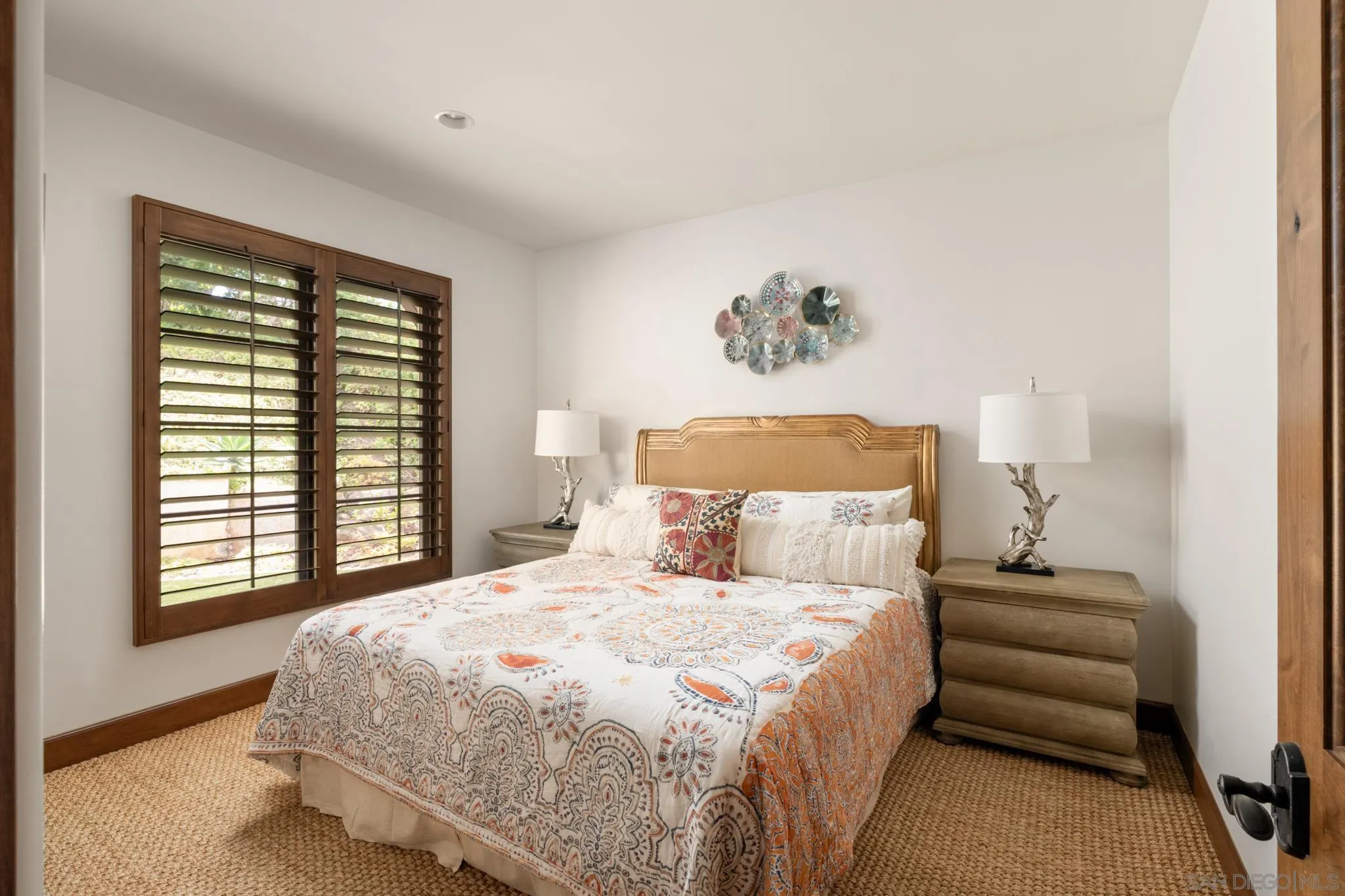 262 Ocean View Avenue Del Mar, CA 92014 - Photo 26 of 45 a bedroom with a bed and a painting on the wall