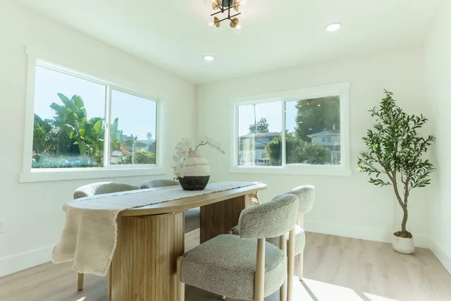 a living room with kitchen island furniture and a kitchen view