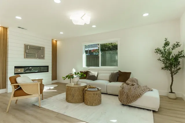 a living room with furniture and a table