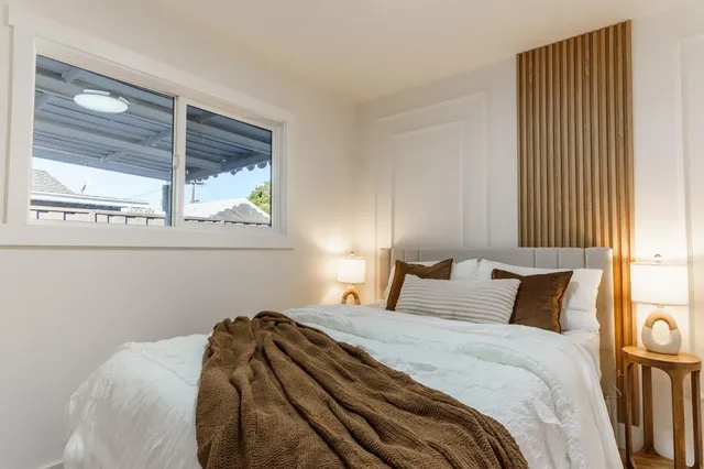 a bathroom with a shower sink and mirror