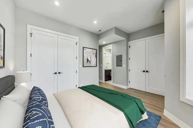 a bedroom with a bed and a couch