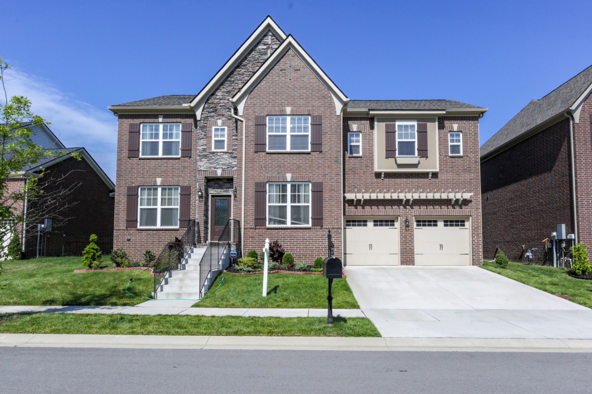 619 Beamon Drive Franklin, TN 37064 - Photo 1 of 43 a front view of a house with a yard and garage