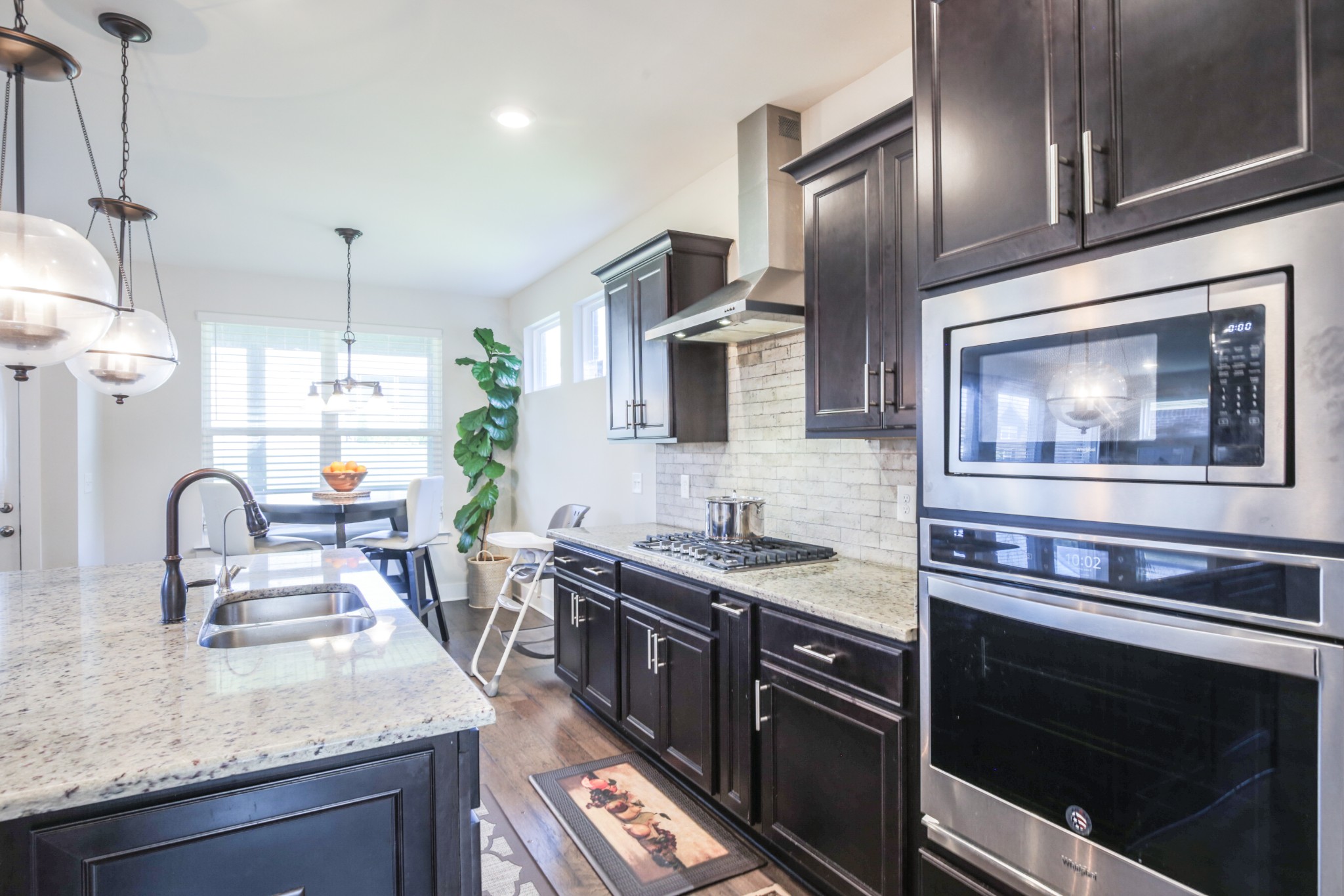 619 Beamon Drive Franklin, TN 37064 - Photo 16 of 43 a kitchen with stainless steel appliances granite countertop a sink stove and refrigerator