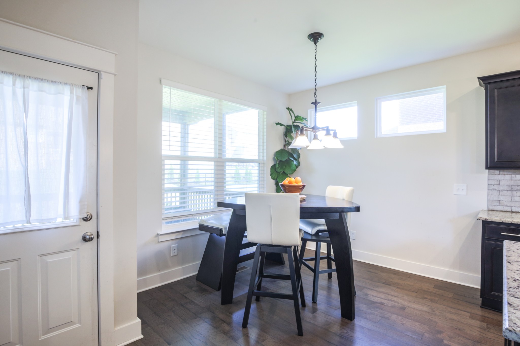 619 Beamon Drive Franklin, TN 37064 - Photo 22 of 43 a view of a dining room with furniture window and wooden floor