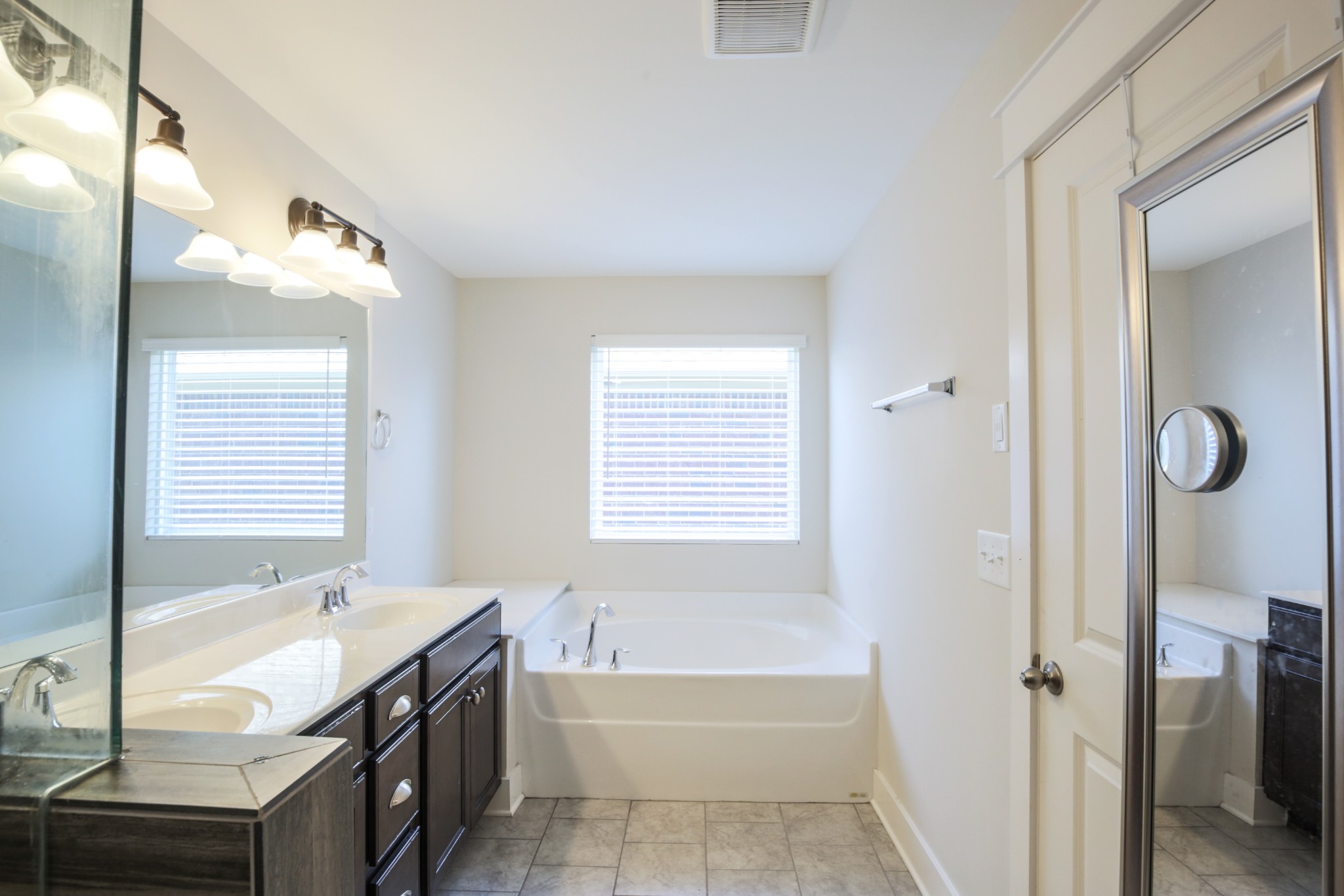 619 Beamon Drive Franklin, TN 37064 - Photo 29 of 43 a bathroom with a tub sink and a mirror