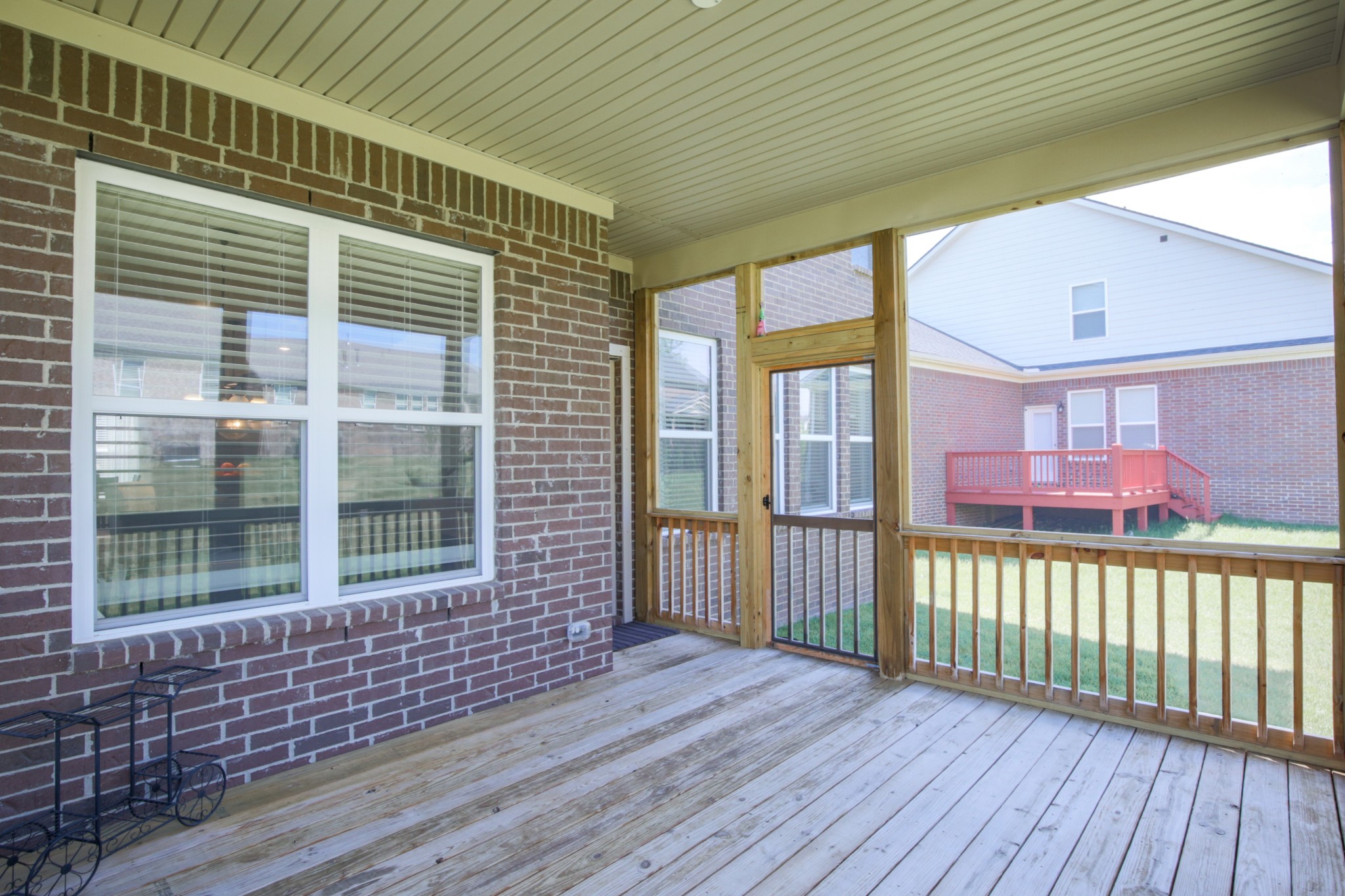 619 Beamon Drive Franklin, TN 37064 - Photo 39 of 43 a view of a porch with wooden floor and floor to ceiling window