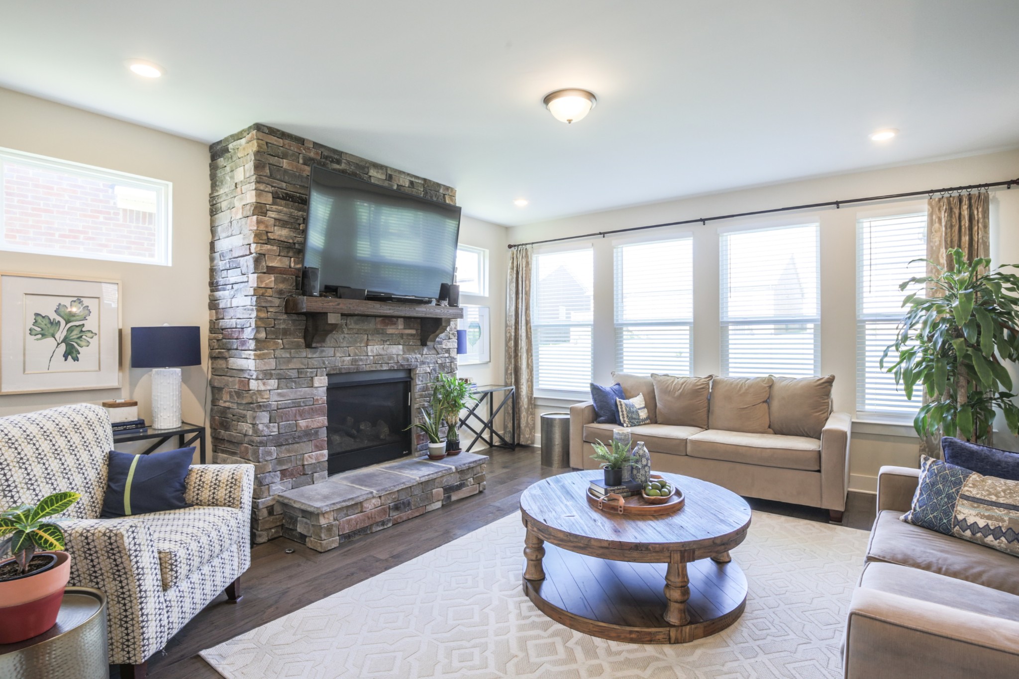 619 Beamon Drive Franklin, TN 37064 - Photo 10 of 43 a living room with furniture a flat screen tv and a fireplace