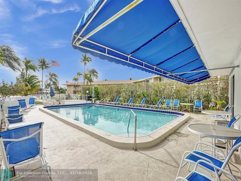 600 Pine Drive, Unit 106 Pompano Beach, FL 33060 - Photo 11 of 15 a view of a swimming pool with a patio