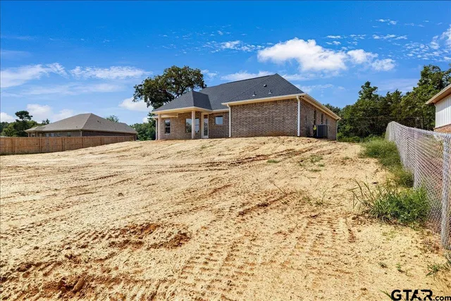 an aerial view of houses with yard
