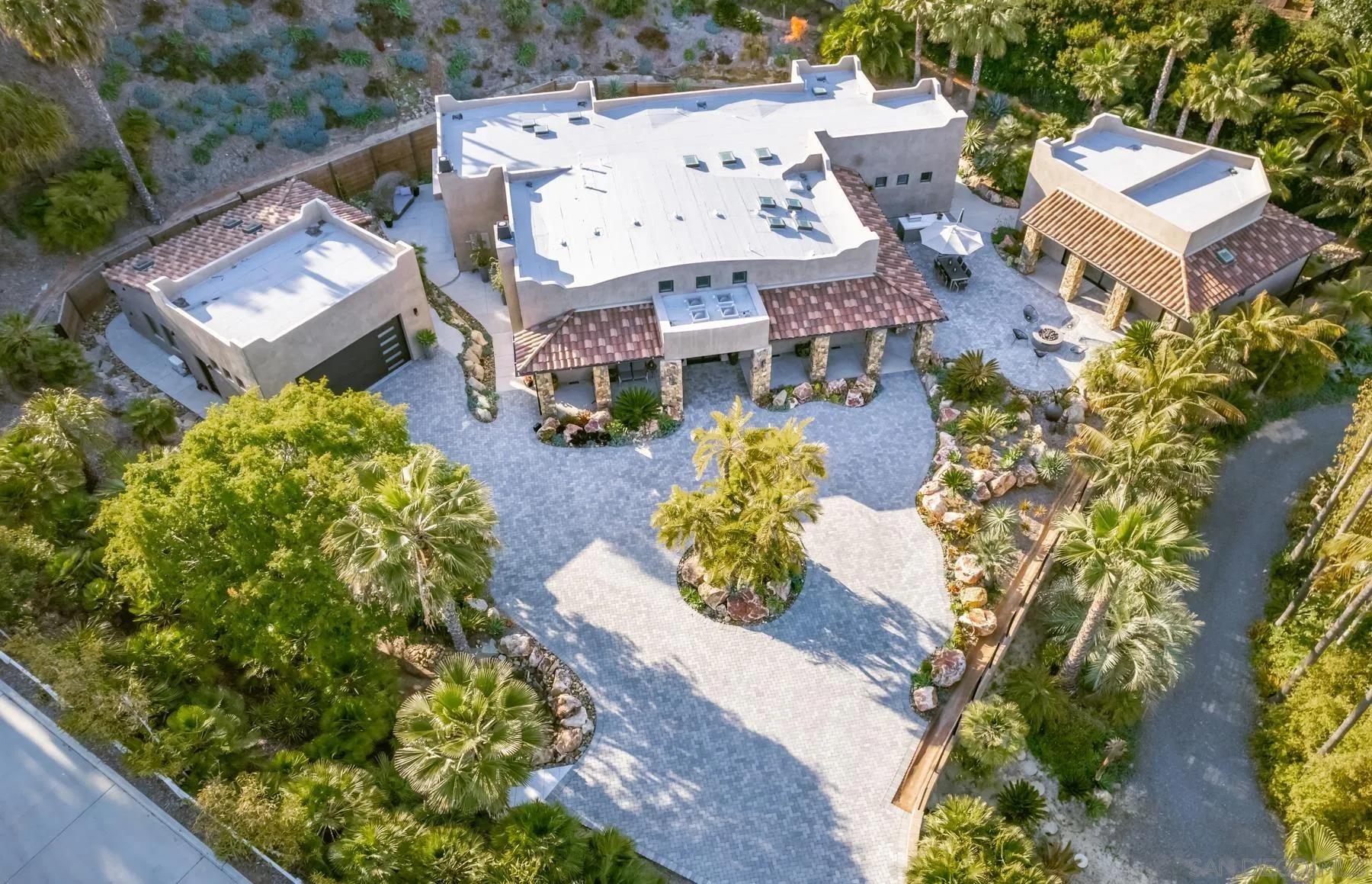 an aerial view of a house with a yard basket ball court and outdoor seating