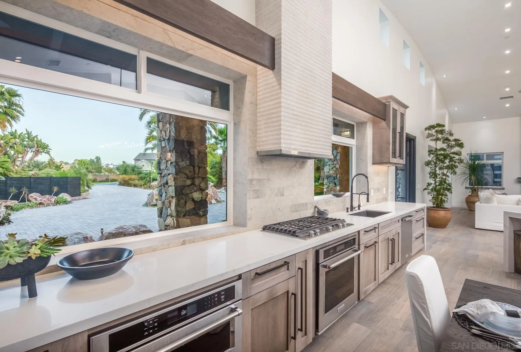 1240 Berryman Canyon Encinitas, CA 92024 - Photo 12 of 66 a kitchen with a stove and a view of living room