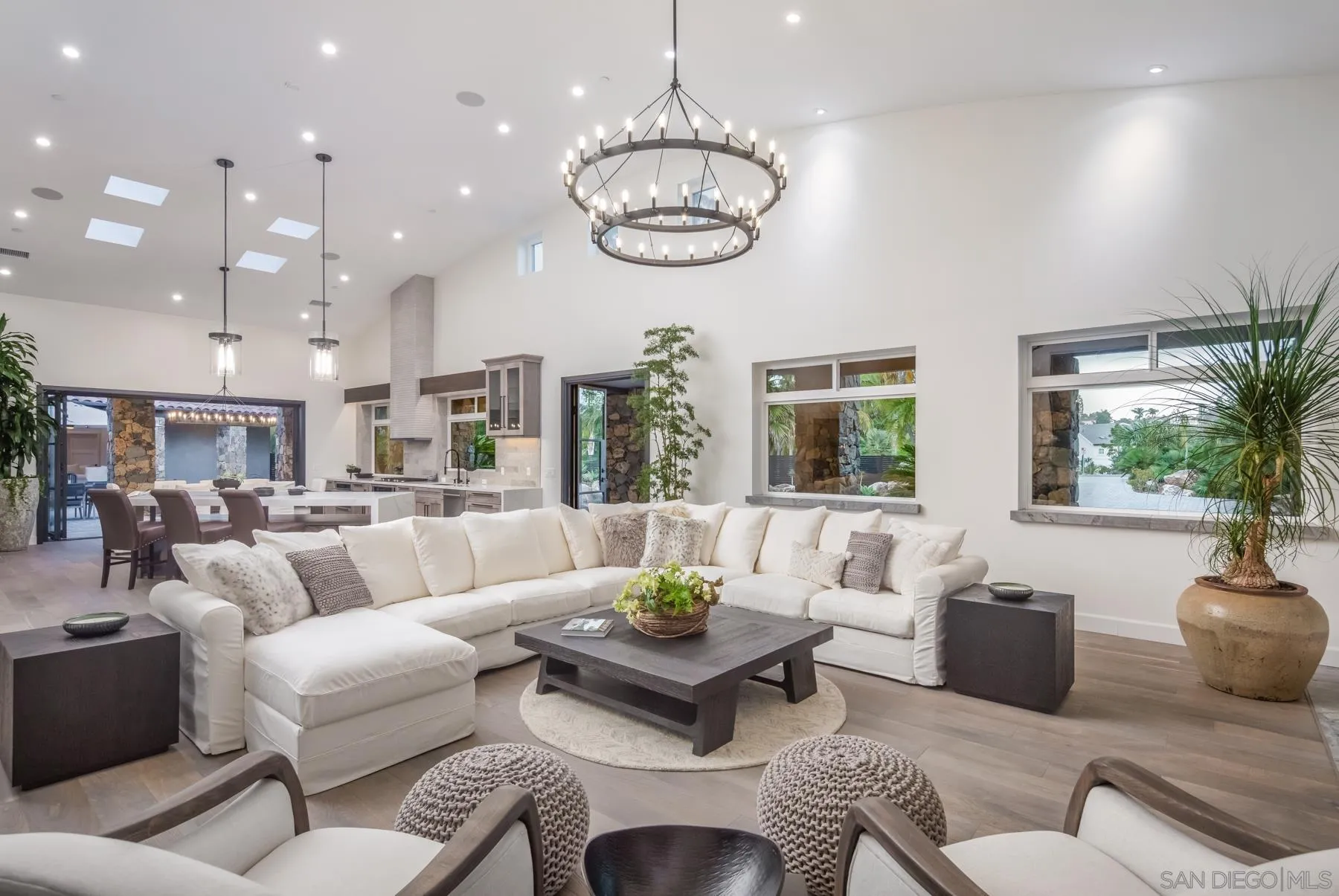 1240 Berryman Canyon Encinitas, CA 92024 - Photo 4 of 66 a living room with furniture kitchen and a chandelier