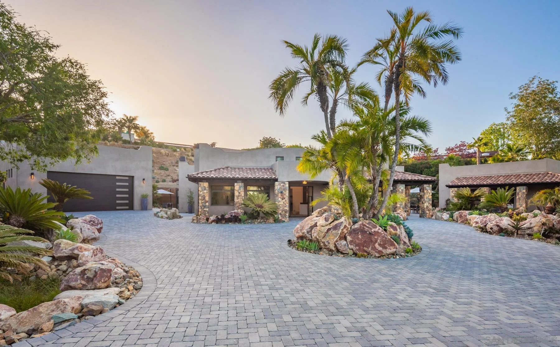 1240 Berryman Canyon Encinitas, CA 92024 - Photo 49 of 66 a palm tree sitting in front of a house with a yard