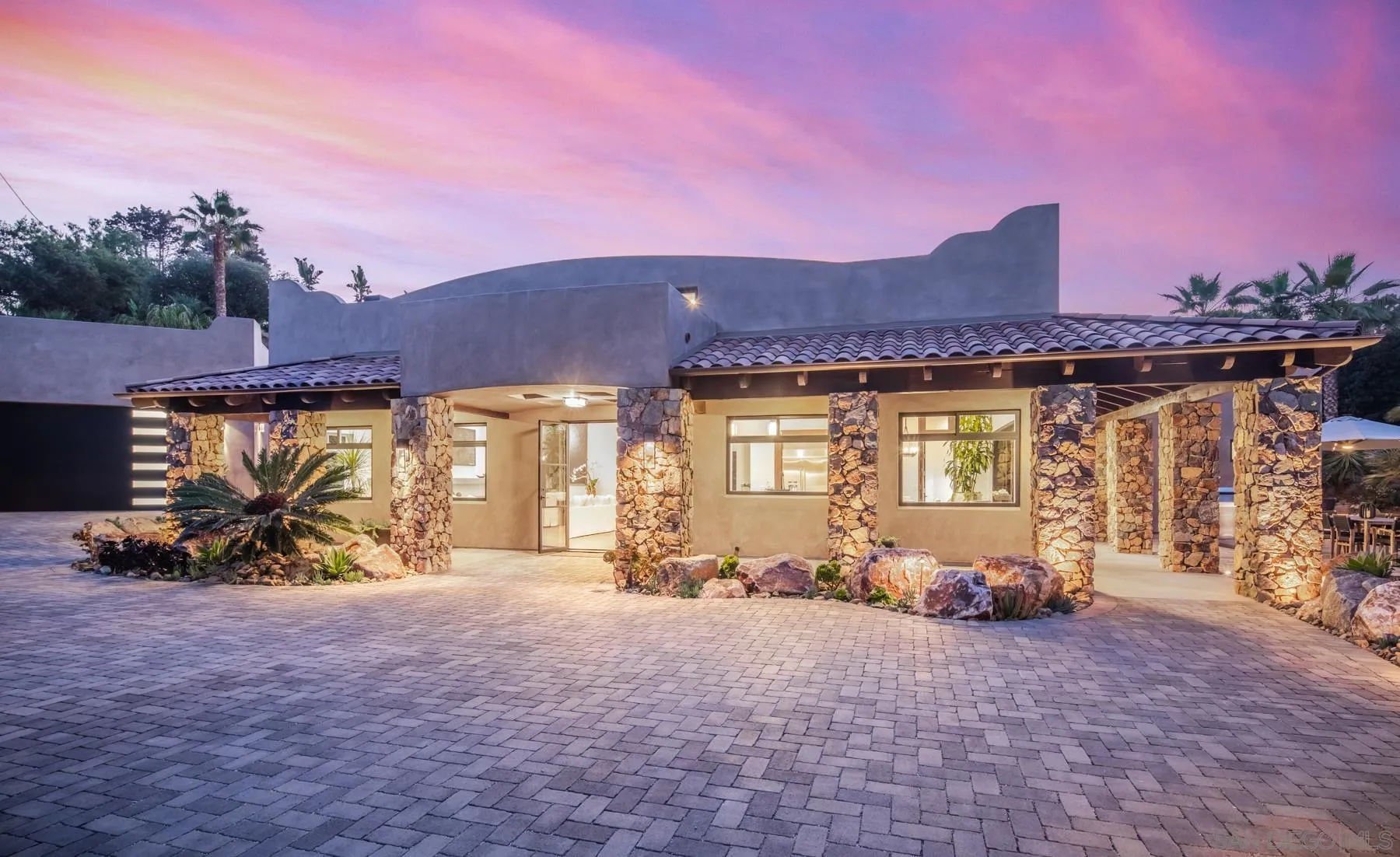 1240 Berryman Canyon Encinitas, CA 92024 - Photo 59 of 66 a front view of a house with a yard and a fire pit