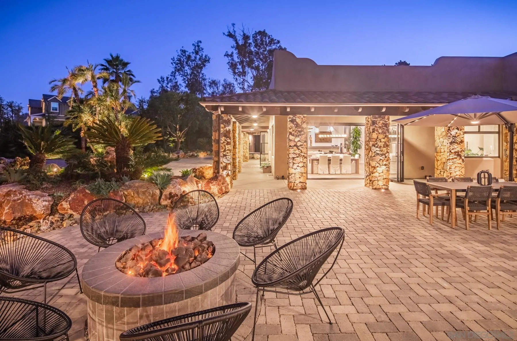 1240 Berryman Canyon Encinitas, CA 92024 - Photo 63 of 66 a living room with furniture a chandelier and a floor to ceiling window