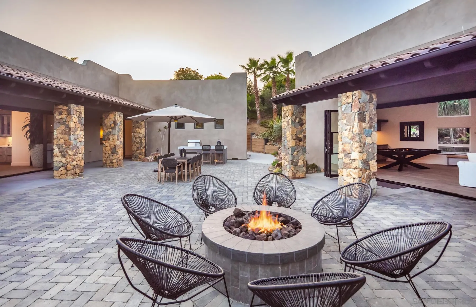 1240 Berryman Canyon Encinitas, CA 92024 - Photo 64 of 66 a living room with furniture a rug and a fireplace