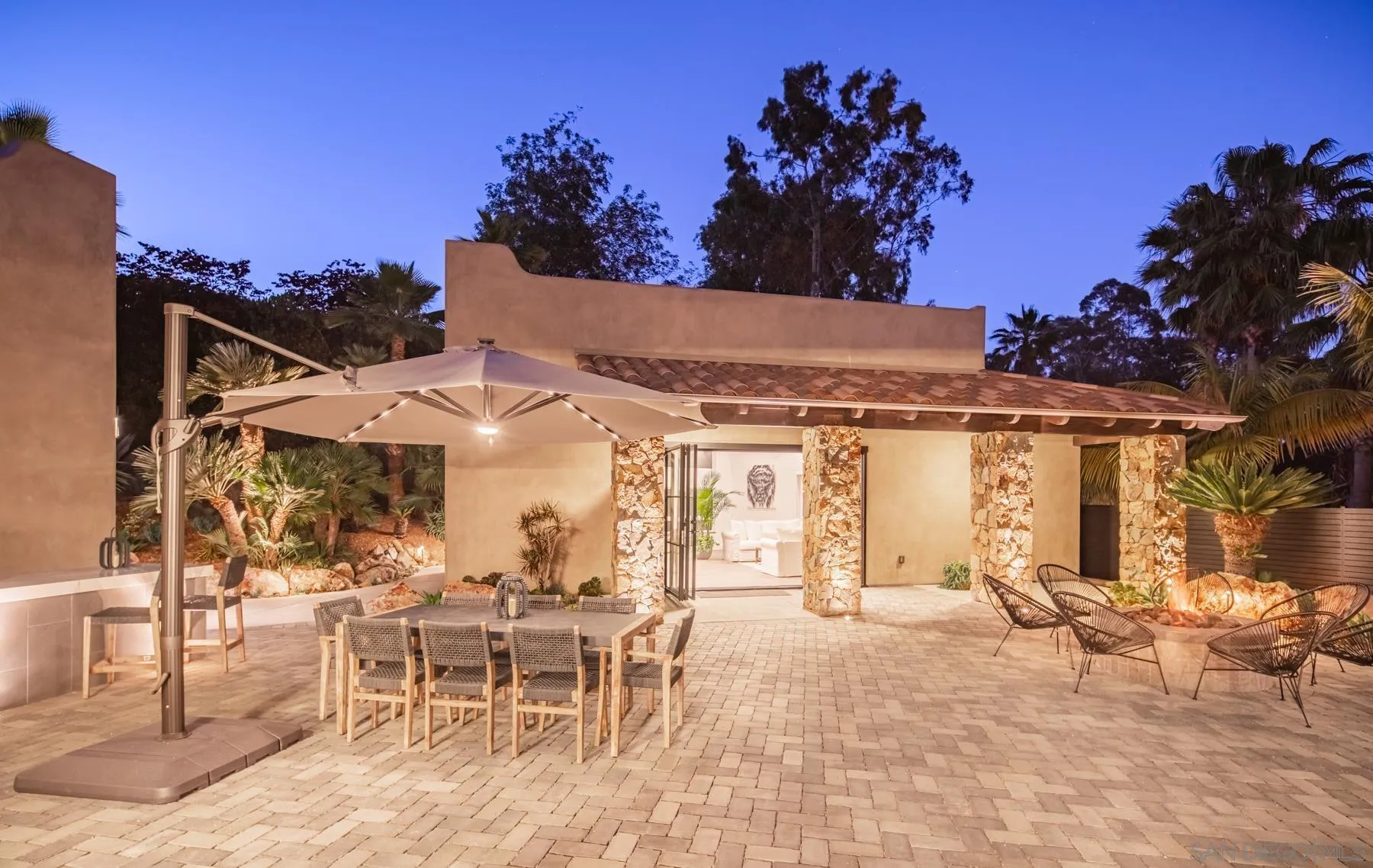 1240 Berryman Canyon Encinitas, CA 92024 - Photo 65 of 66 a view of a patio with a table and chairs and potted plants