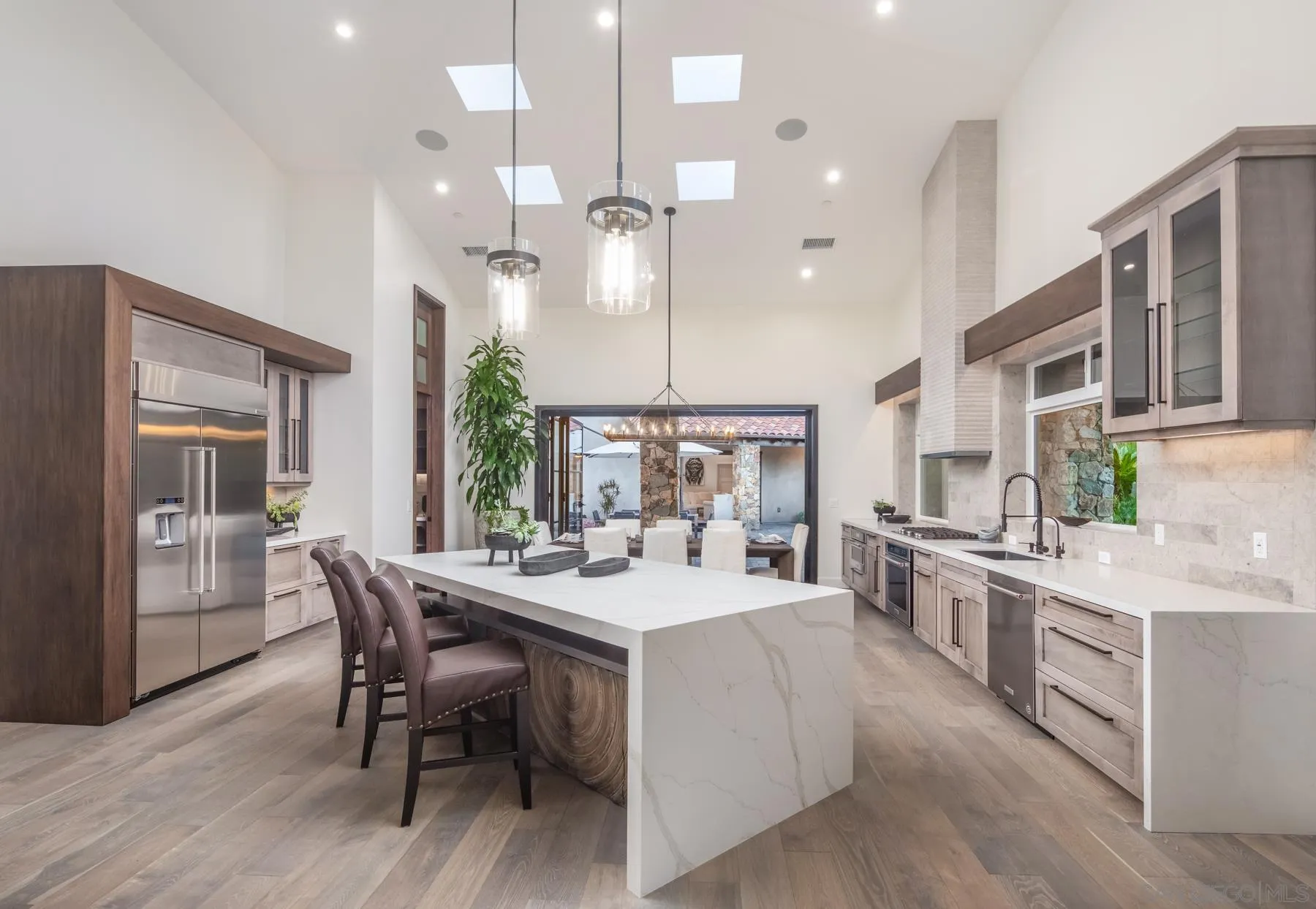 1240 Berryman Canyon Encinitas, CA 92024 - Photo 8 of 66 a large kitchen with a table and chairs