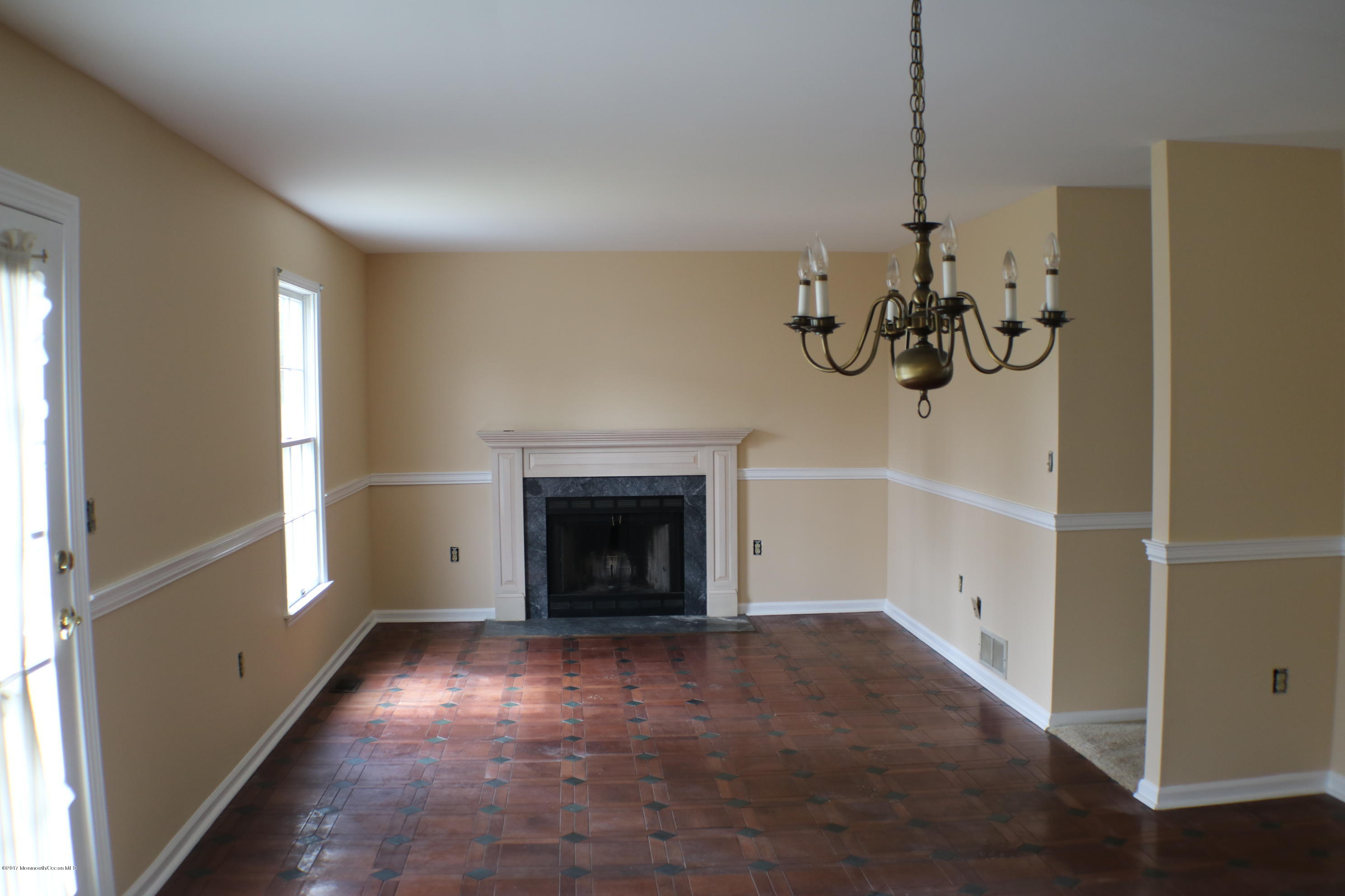 164 Equinox Road Manahawkin, NJ 08050 - Photo 12 of 35 a view of an empty room with a window