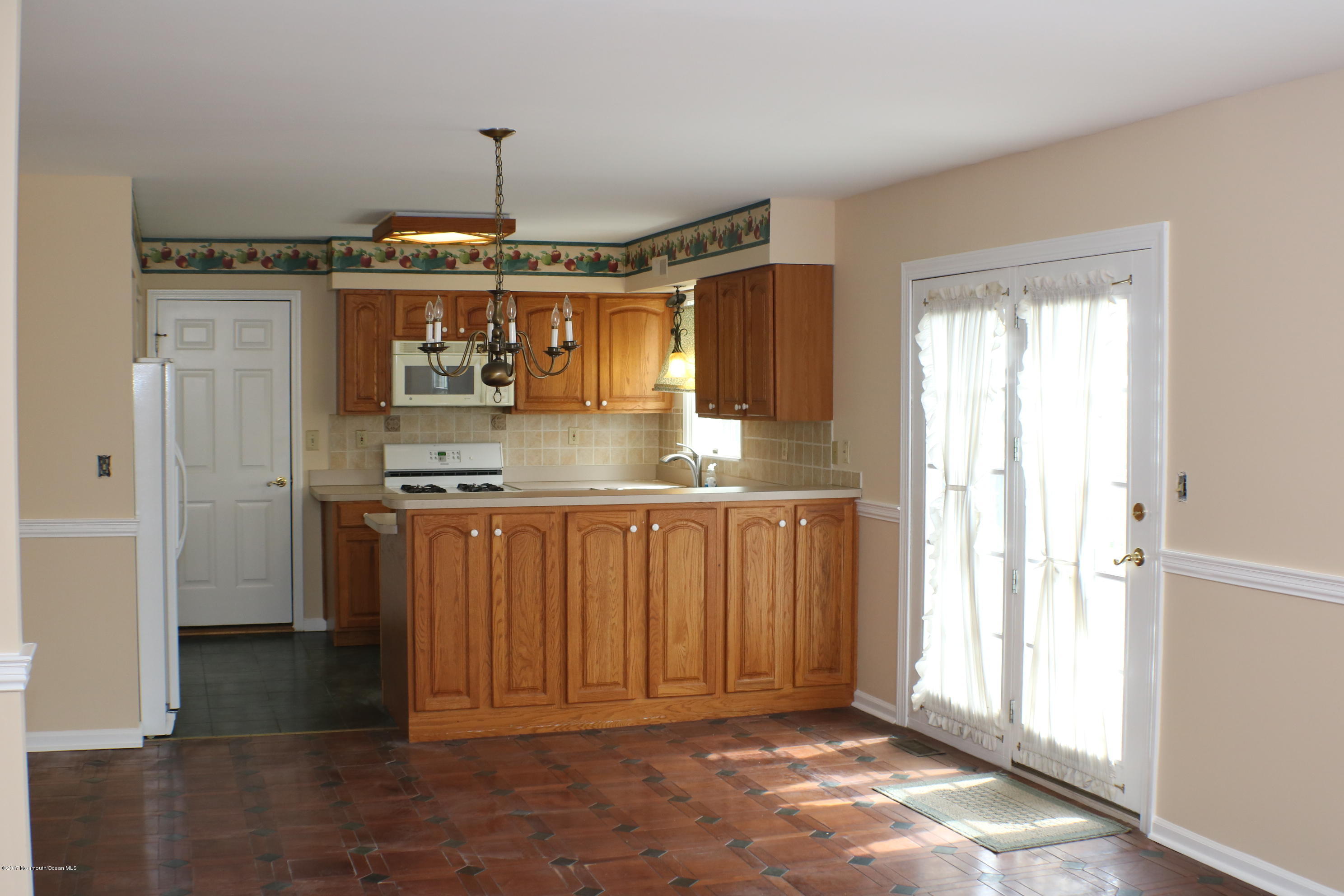 164 Equinox Road Manahawkin, NJ 08050 - Photo 15 of 35 a kitchen with stainless steel appliances granite countertop a refrigerator and a sink