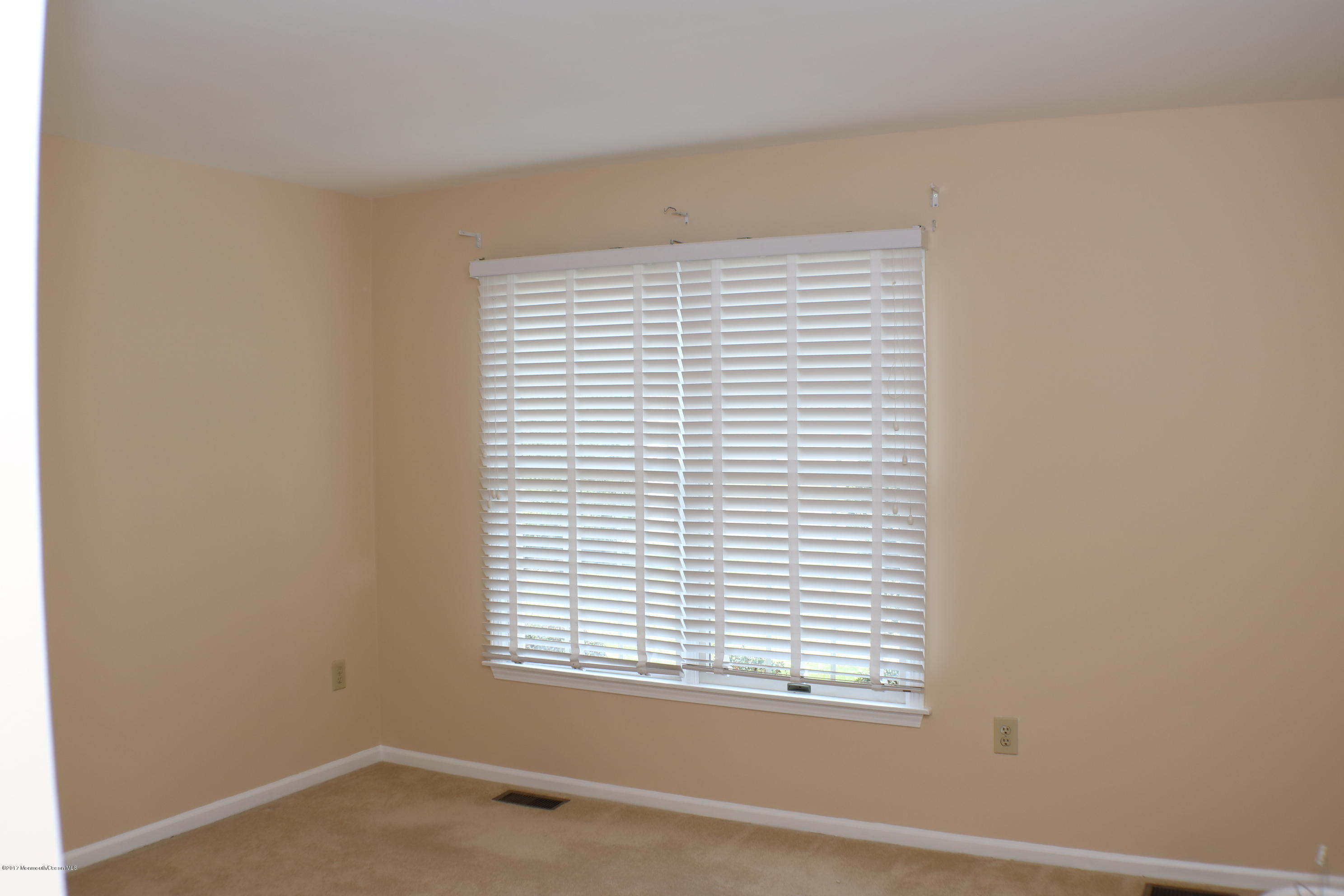 164 Equinox Road Manahawkin, NJ 08050 - Photo 18 of 35 an empty room with a window