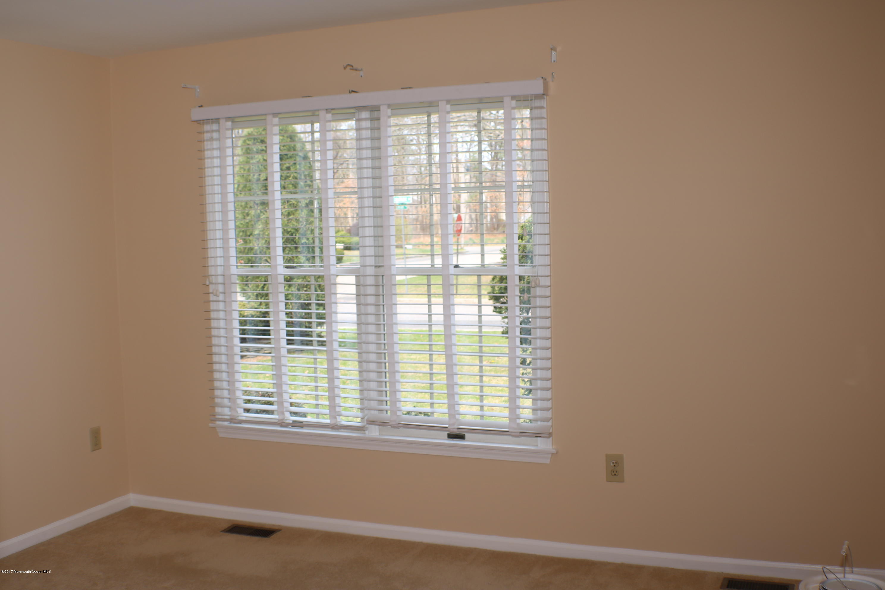 164 Equinox Road Manahawkin, NJ 08050 - Photo 19 of 35 a view of an empty room with a window