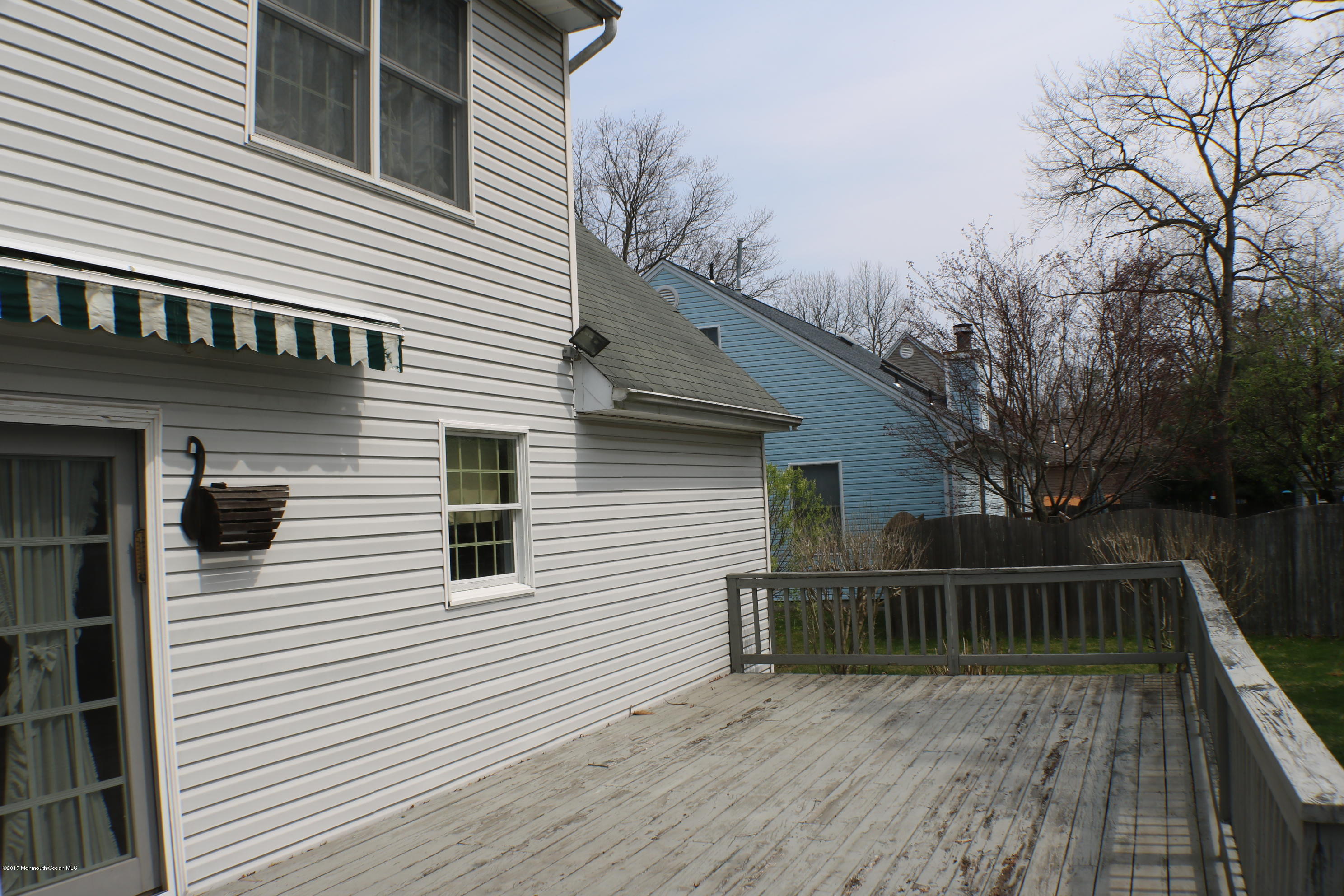 164 Equinox Road Manahawkin, NJ 08050 - Photo 22 of 35 a view of a house with a deck