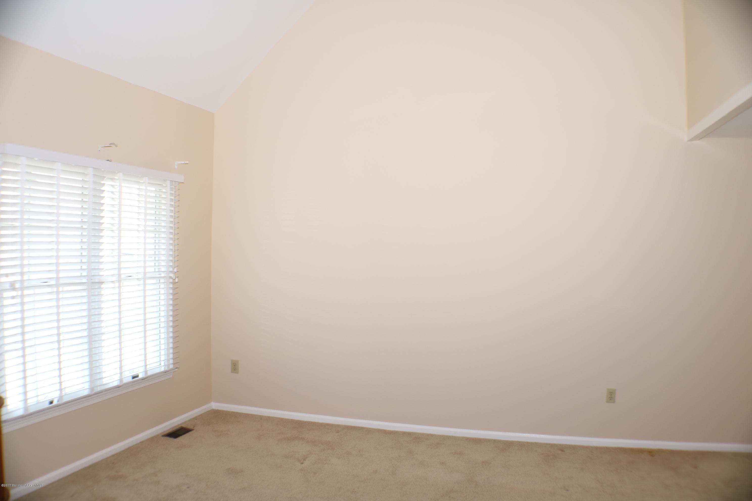164 Equinox Road Manahawkin, NJ 08050 - Photo 25 of 35 an empty room with a window