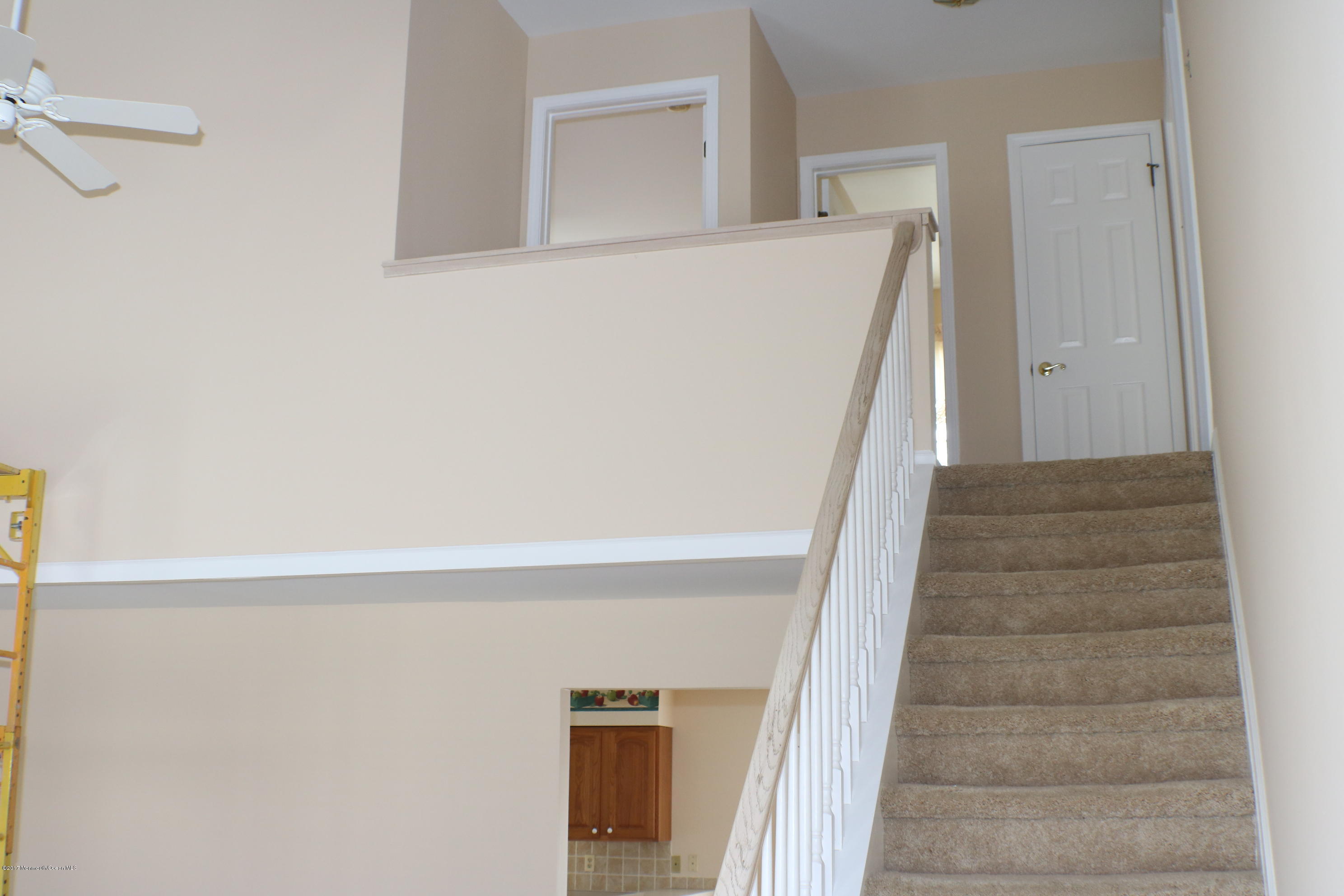164 Equinox Road Manahawkin, NJ 08050 - Photo 27 of 35 a view of staircase with white walls