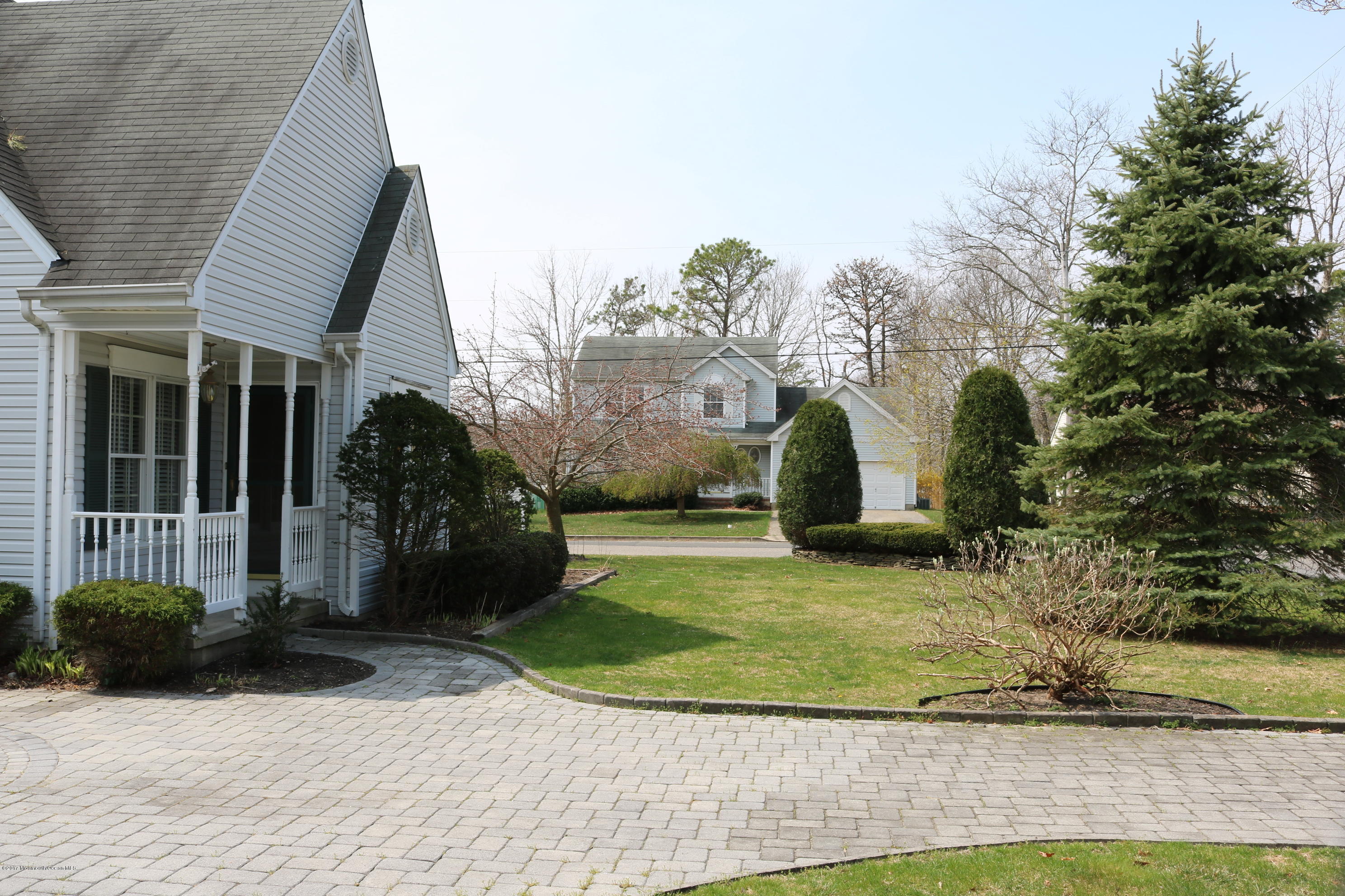 164 Equinox Road Manahawkin, NJ 08050 - Photo 34 of 35 a view of a house with a yard