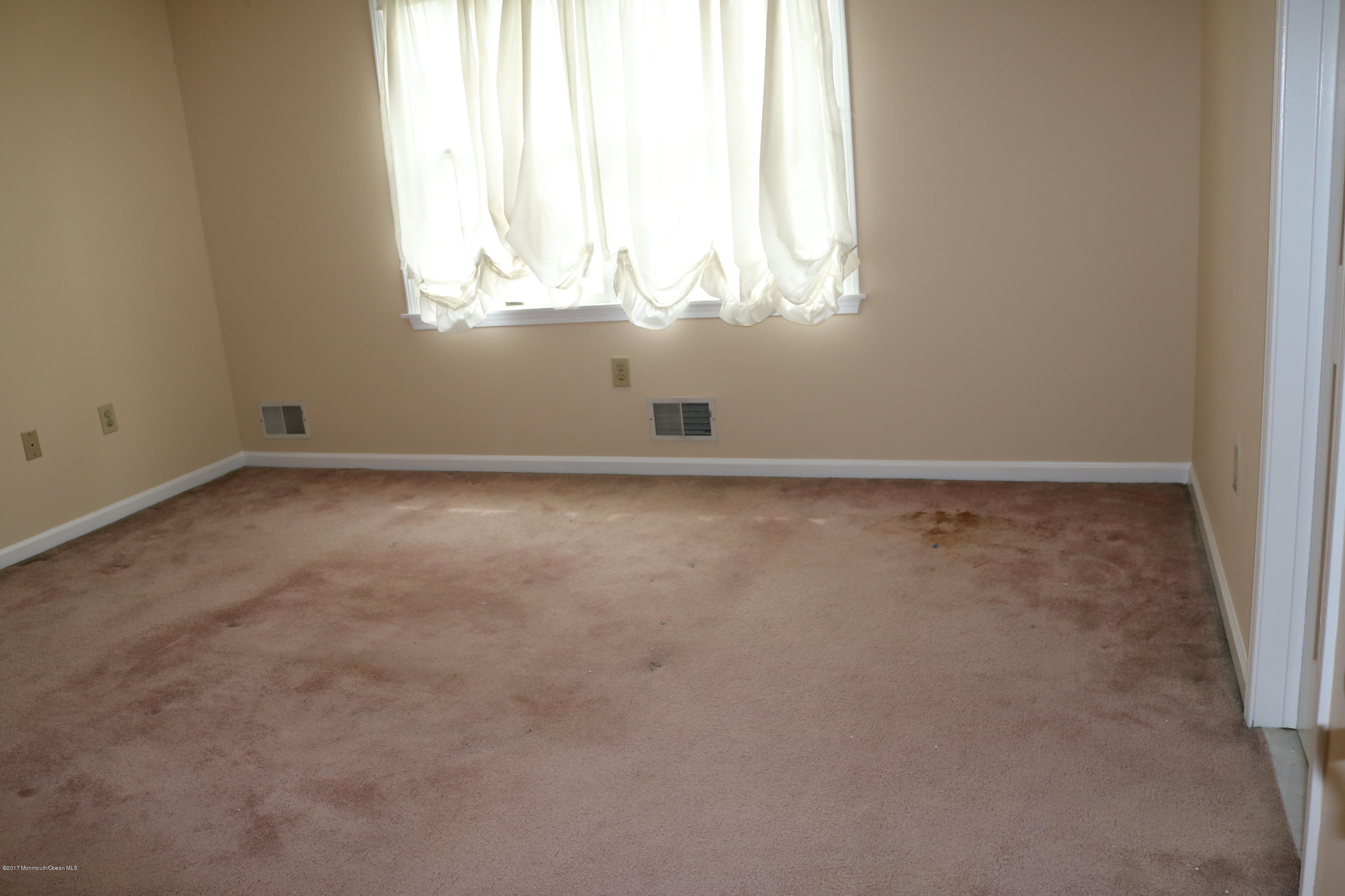 164 Equinox Road Manahawkin, NJ 08050 - Photo 4 of 35 an empty room with window