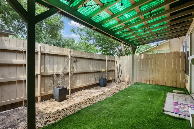 a view of a house with a yard and garage