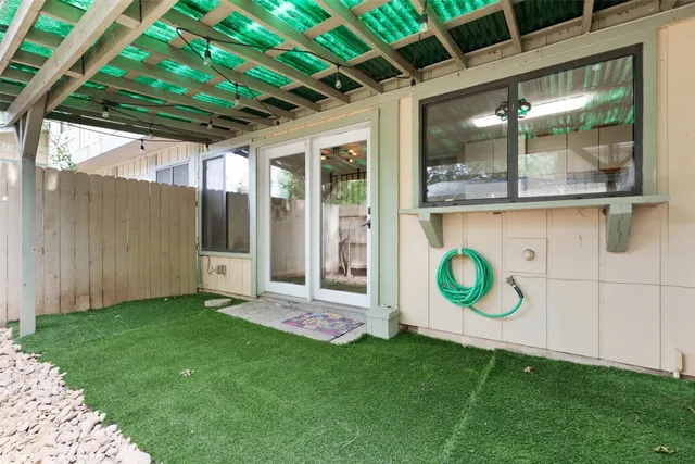a view of a backyard with a cabin