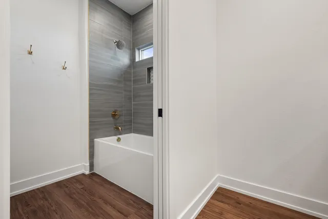 a view of bathroom with a tub and sink