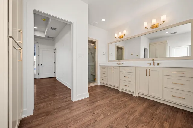 a view of walk in closet with empty racks