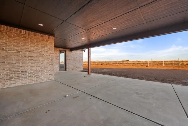 a view of an empty room with a fireplace