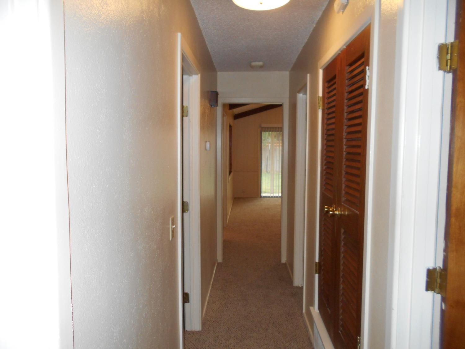 5401 14th Street Lubbock, TX 79416 - Photo 13 of 17 a view of a bathroom from a hallway