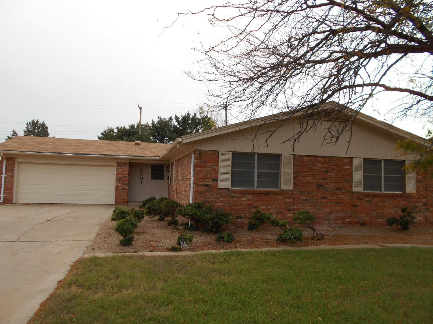 5401 14th Street Lubbock, TX 79416 - Photo 2 of 17 a house that has a tree in front of it